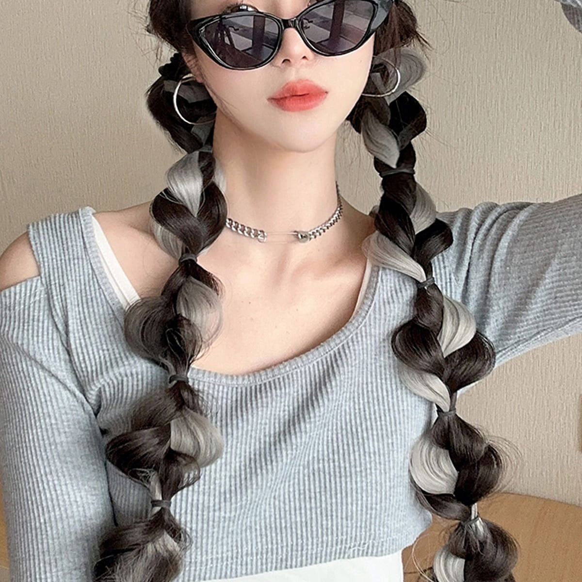 Wig has a long braid and is black and gray 1 piece 1 each